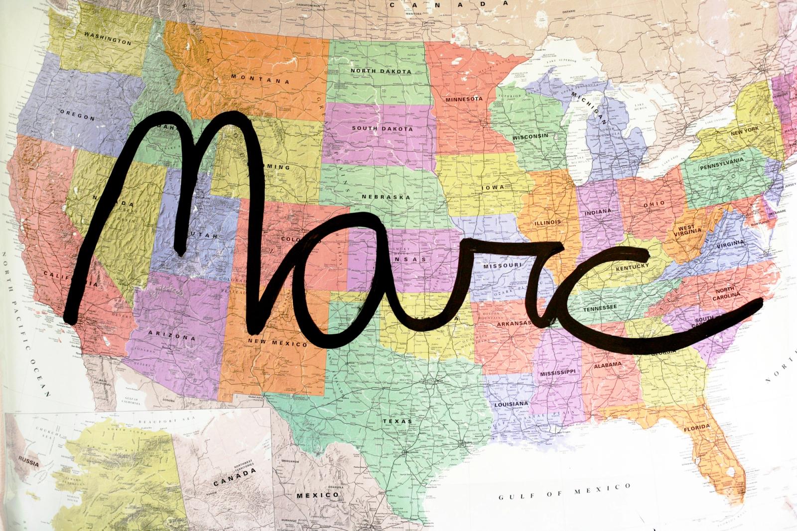 Marc’s signature drawn across a map of the United States, forming the route for his cross-country drive.